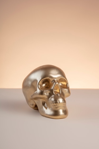 Free photo gold aesthetic wallpaper with skull