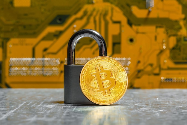 Gold bitcoin and padlock