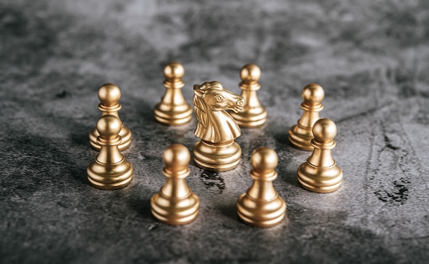 Free photo gold chess on chess board game for business metaphor leadership concept