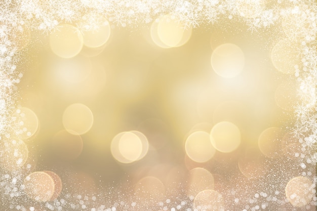 Free photo gold christmas background with snowy border