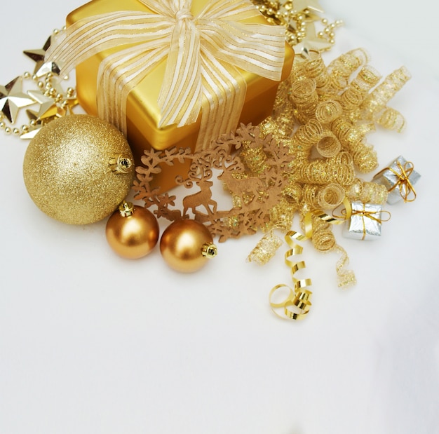 Gold Christmas gift and decorations on white background