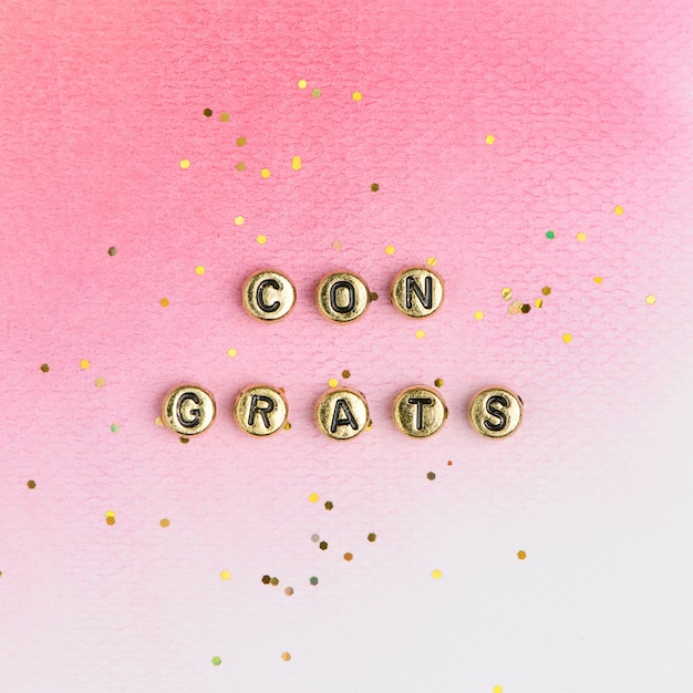 Free photo gold congrats beads text typography on pink