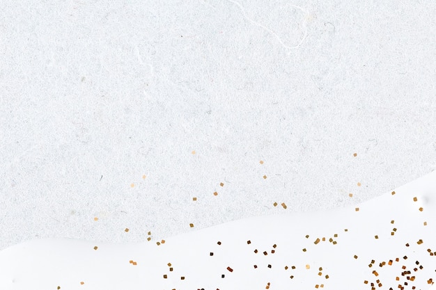 Free Photo gold glitter on abstract white background