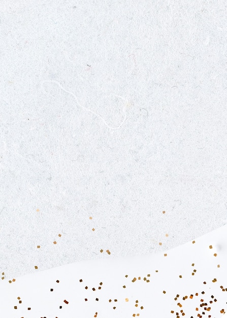 Gold glitter on abstract white background