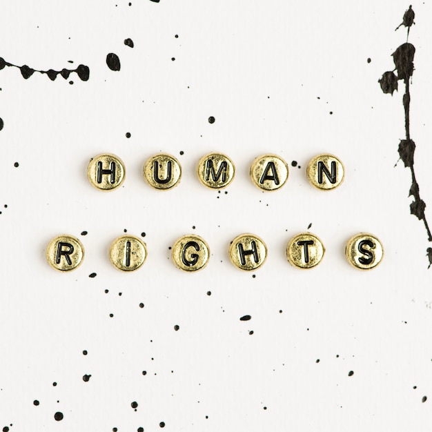 Free Photo gold human rights word beads