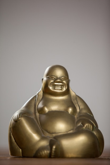 Gold painted laughing buddha figurine