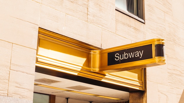 Free photo gold sign board of subway