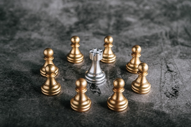 Free Photo gold and silver chess on chess board game for business metaphor leadership concept