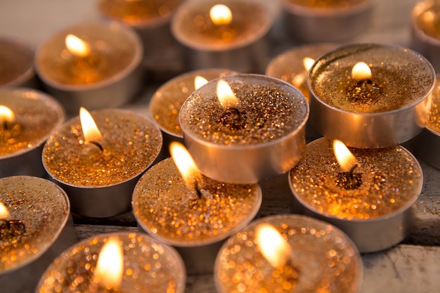 Free Photo golden candles lit