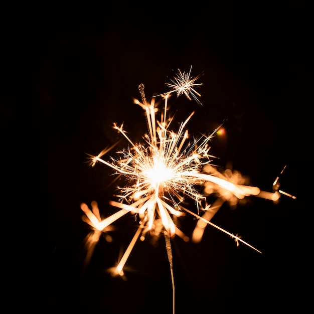 Golden firework at night on sky