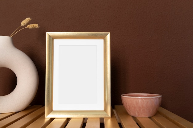 Free photo golden frame and decoration arrangement