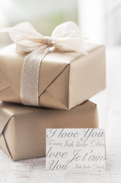 Golden gift packages with a letter