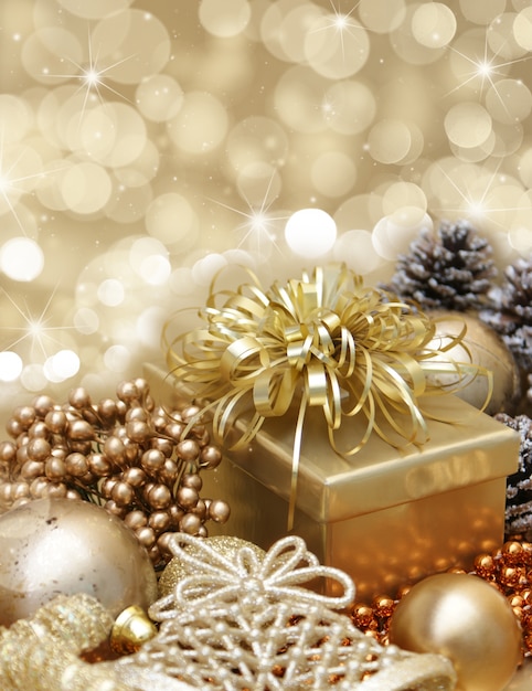 Golden gift with christmas ornaments