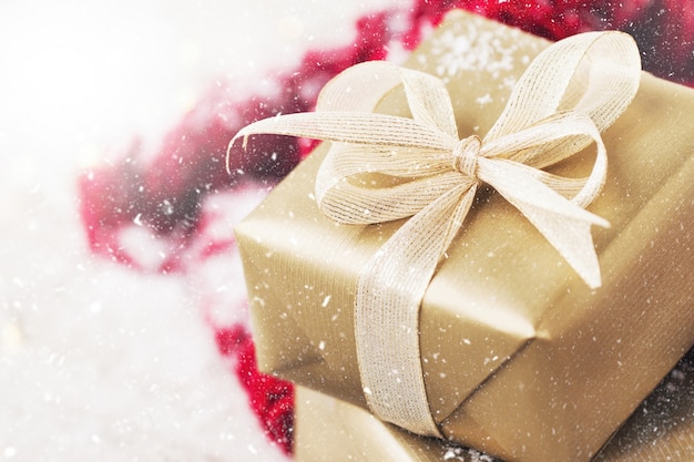 Free photo golden gift with a white bow