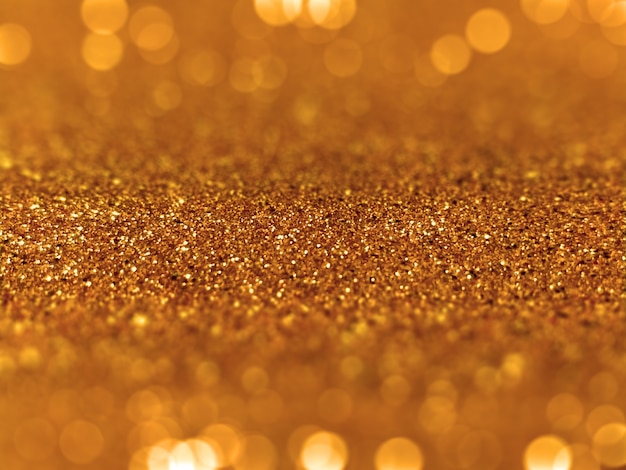 Free photo golden glitter defocused bokeh background