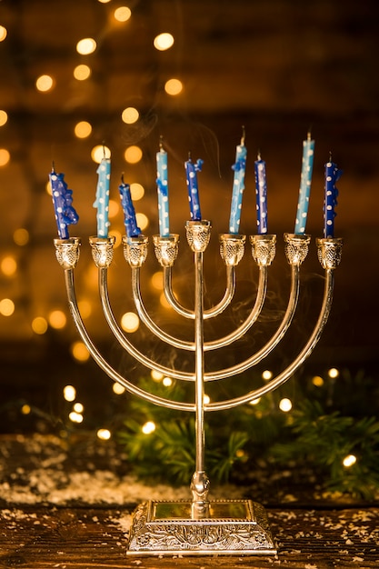 Free Photo golden menorah with candles