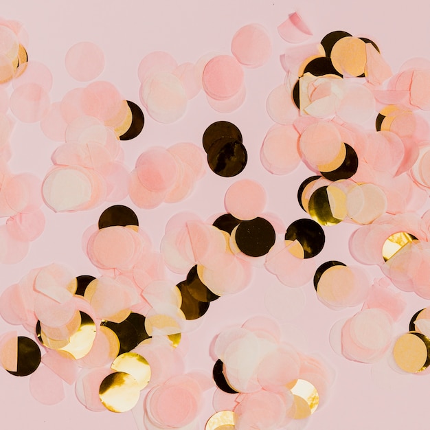 Free Photo golden and pink confetti at new years party