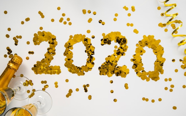 Free Photo golden sequins with 2020 new year digits