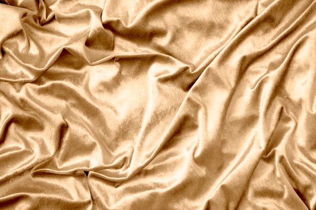 Free Photo golden shiny silk fabric texture