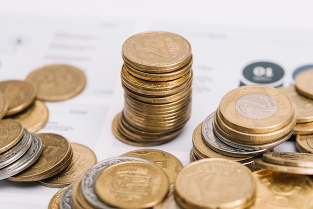 Free Photo golden stack of coins over the infographic template