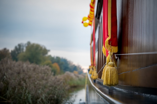 Free photo golden tassels hanging over a boat in elburg, netherlands