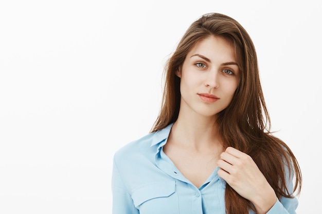 Good-looking brunette businesswoman posing in the studio