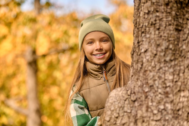 Good mood. A cute girl feeling good while playing in the park