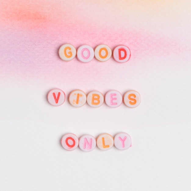 Free photo good vibes only beads message typography on pastel