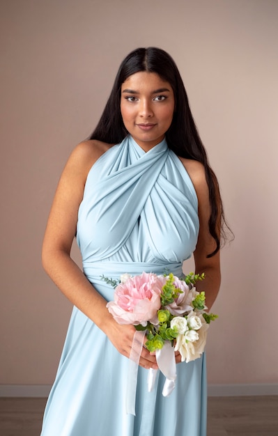 Gorgeous portrait of bridesmaid with flower boquete