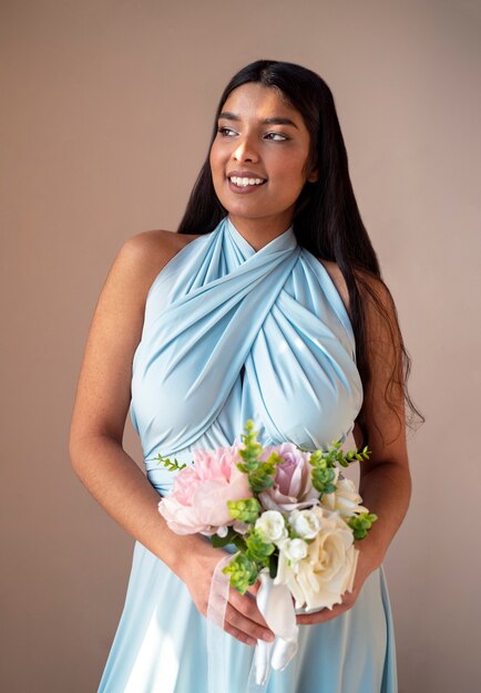 Gorgeous portrait of bridesmaid with flower boquete