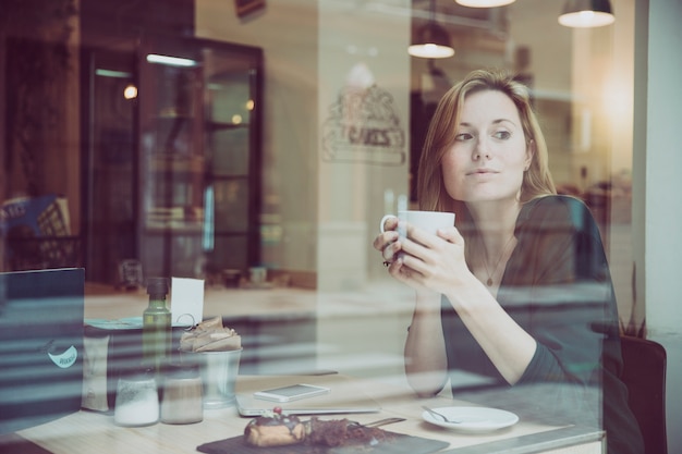 Gorgeous woman enjoying hot drink