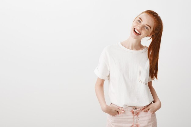 Gorgeous young woman looking enthusiastic with happy smile