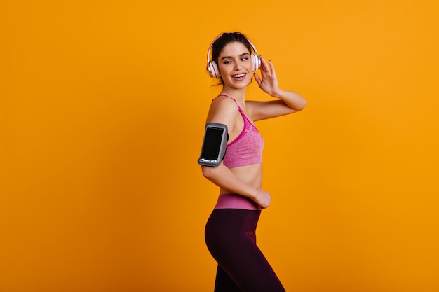 Free photo graceful woman enjoying pilates