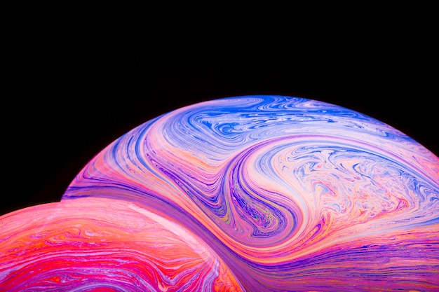 Free photo gradient multicolored soap bubbles on black background