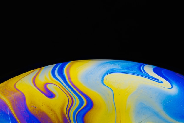 Free Photo gradient smooth colorful soap bubble on black background