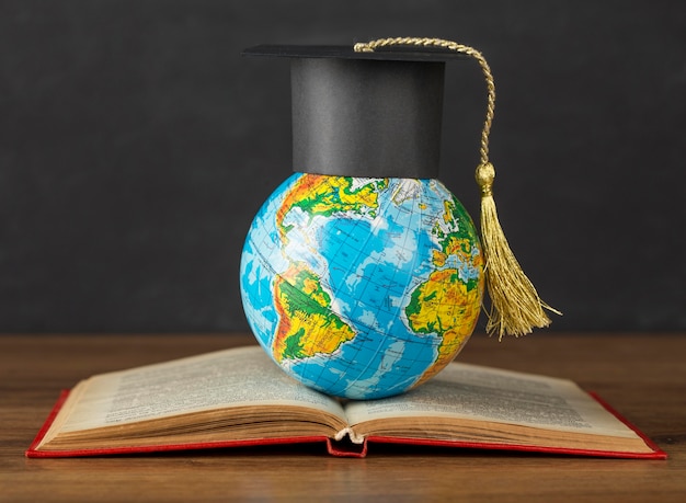 Graduation cap on earth globe