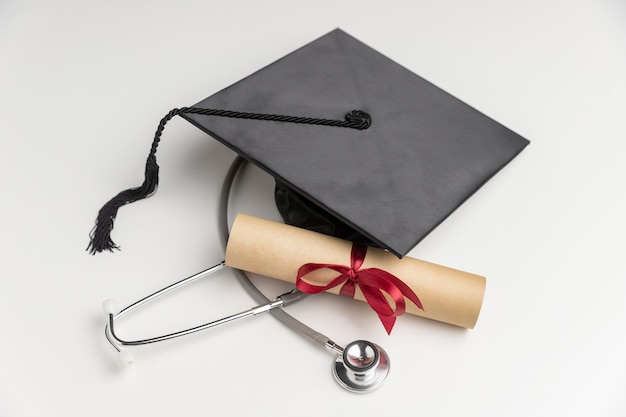 Graduation diploma and toga hat