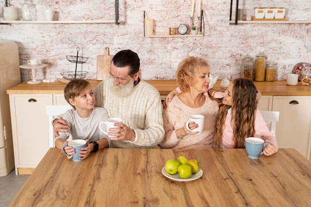 Grandchildren spending time together with their grandparents