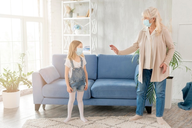 Grandma and girl with mask