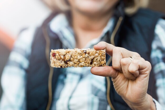 Grandma holding a homemade energy bar