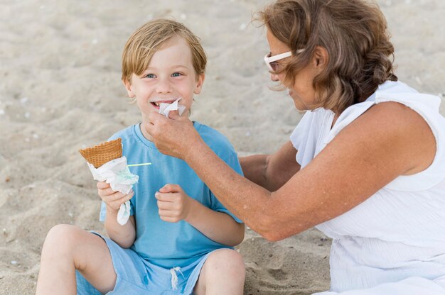 Grandmother cleaning smiley kid