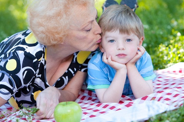 Grandmother kissing her grandson