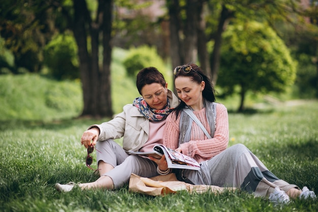 Grandmother mother daughter in park picnic