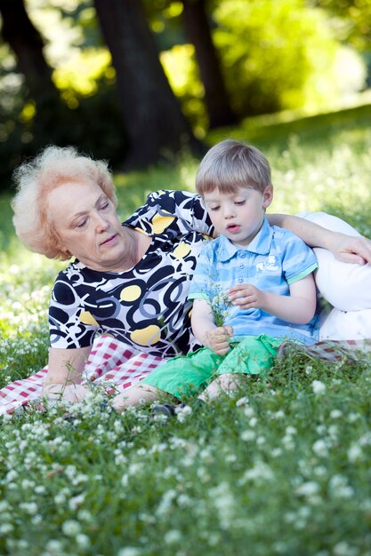 Grandmother with her grandson in the park