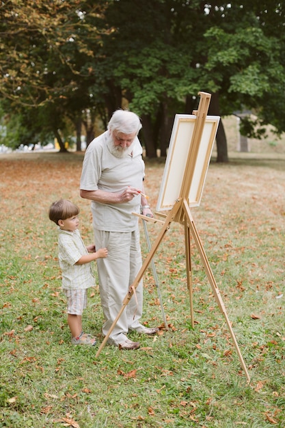 Grandpa with grandon outdoor painting