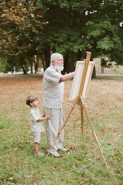 Grandpa with grandson painting