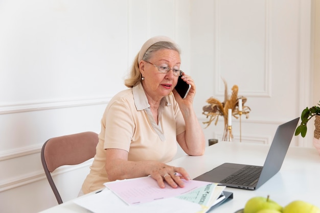 Grandparent learning to use digital device