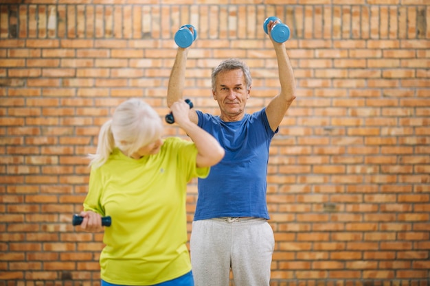 Free Photo grandparents working out in gym