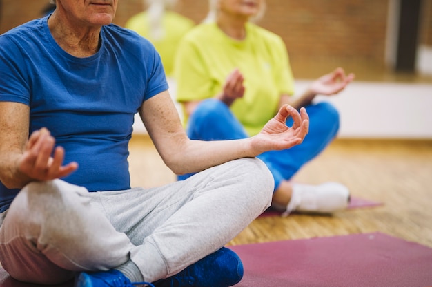 Grandparents in yoga pose