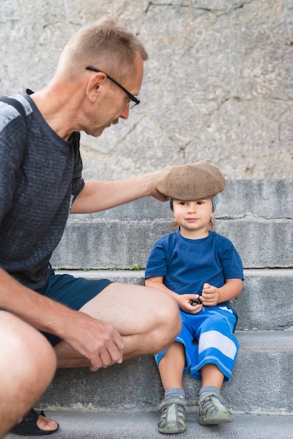 Grandson on stairs with grandpa